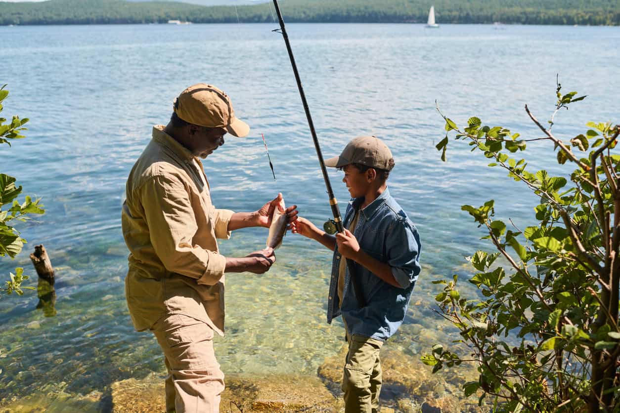 older man and young boy fishing