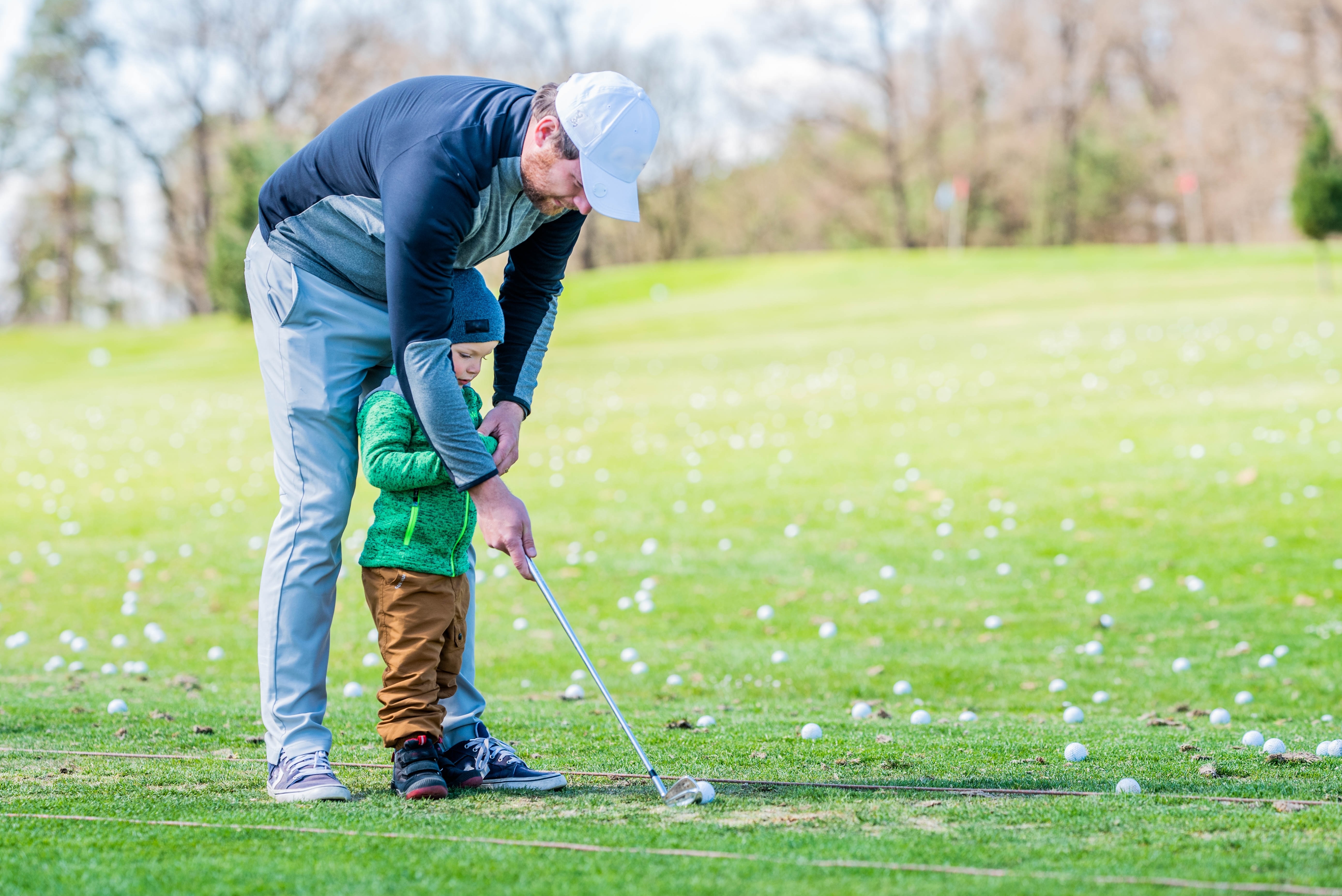 Dad and Son Playing Golf