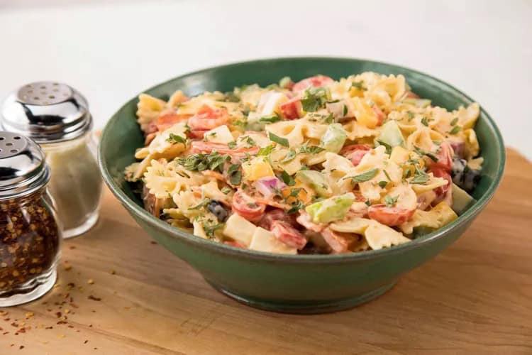 a pizza pasta salad in a bowl