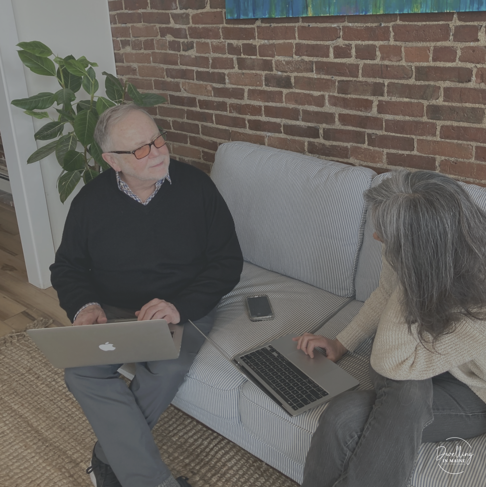Gary Kittredge and Laura Amey in the office at Dwelling in Maine Real Estate 