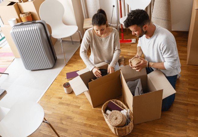 Couple Packing Moving Boxes