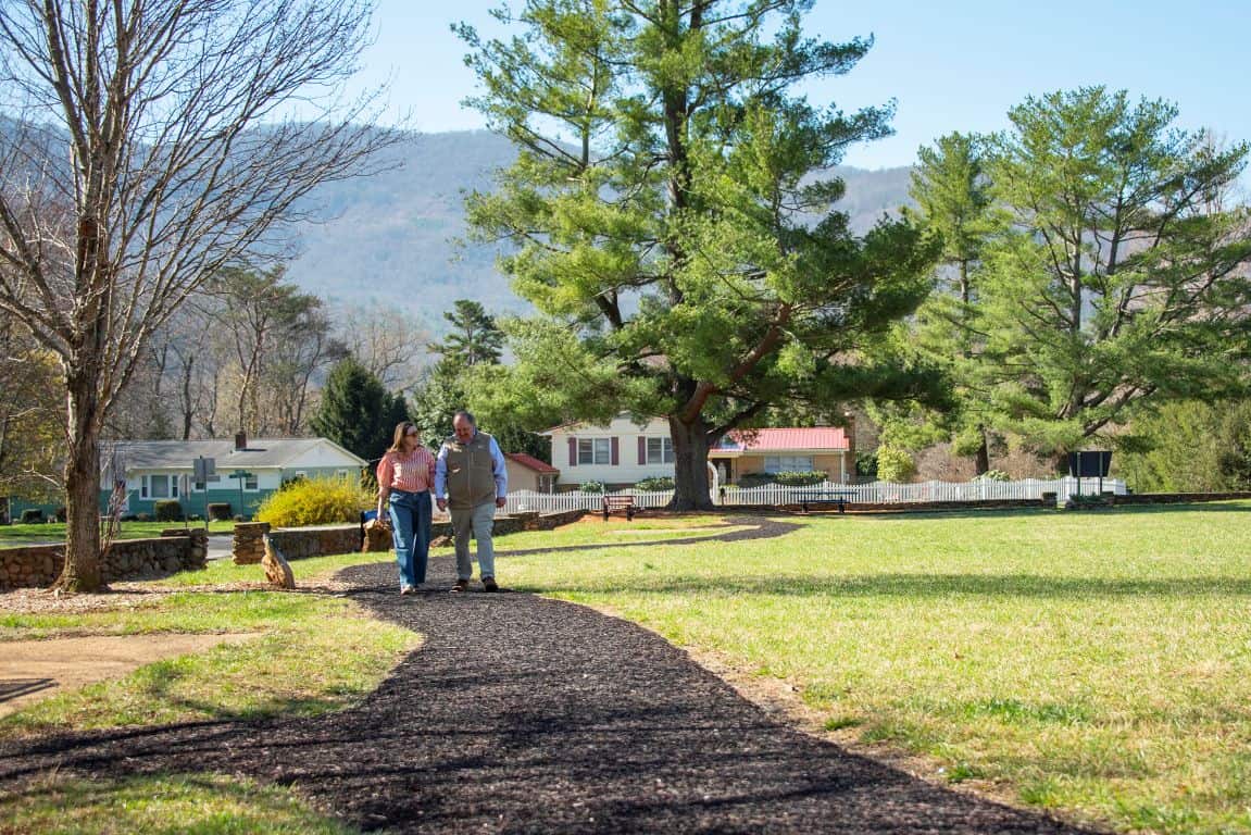 Couple walking at Grovemont Park in Swannanoa NC