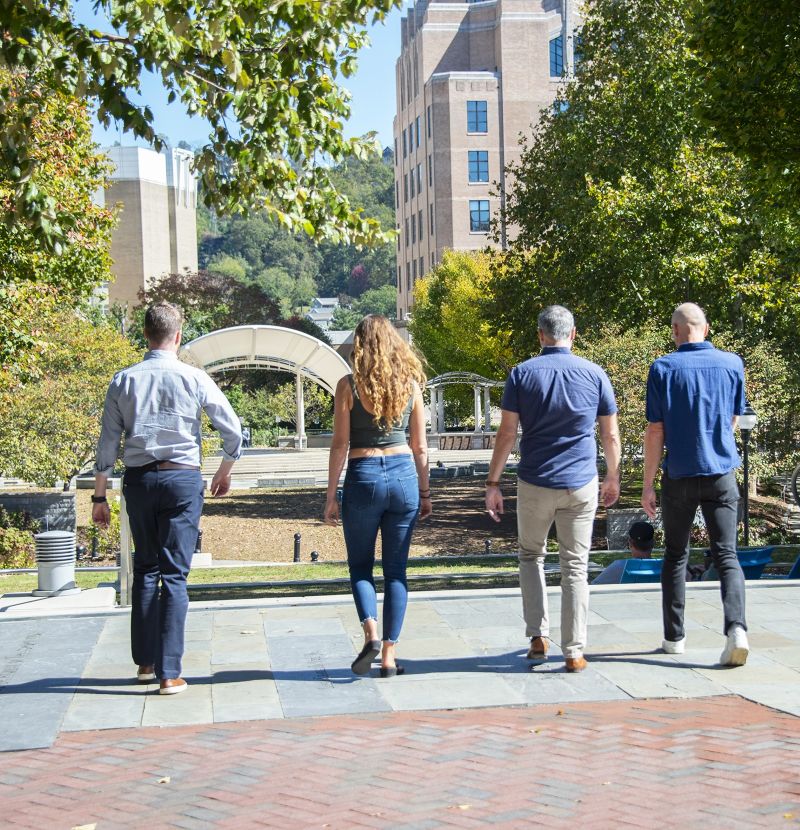 Realtors walking with clients in downtown Asheville