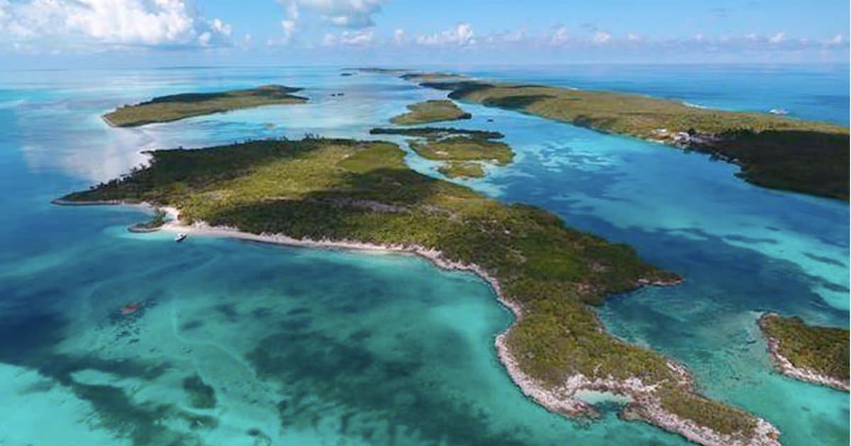Bahamas private island for sale — aerial view of uninhabited cays surrounded by turquoise water
