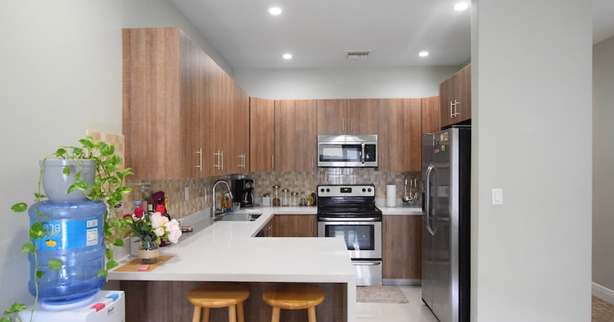 Venetian West Nassau Bahamas modern kitchen interior with stainless steel appliances