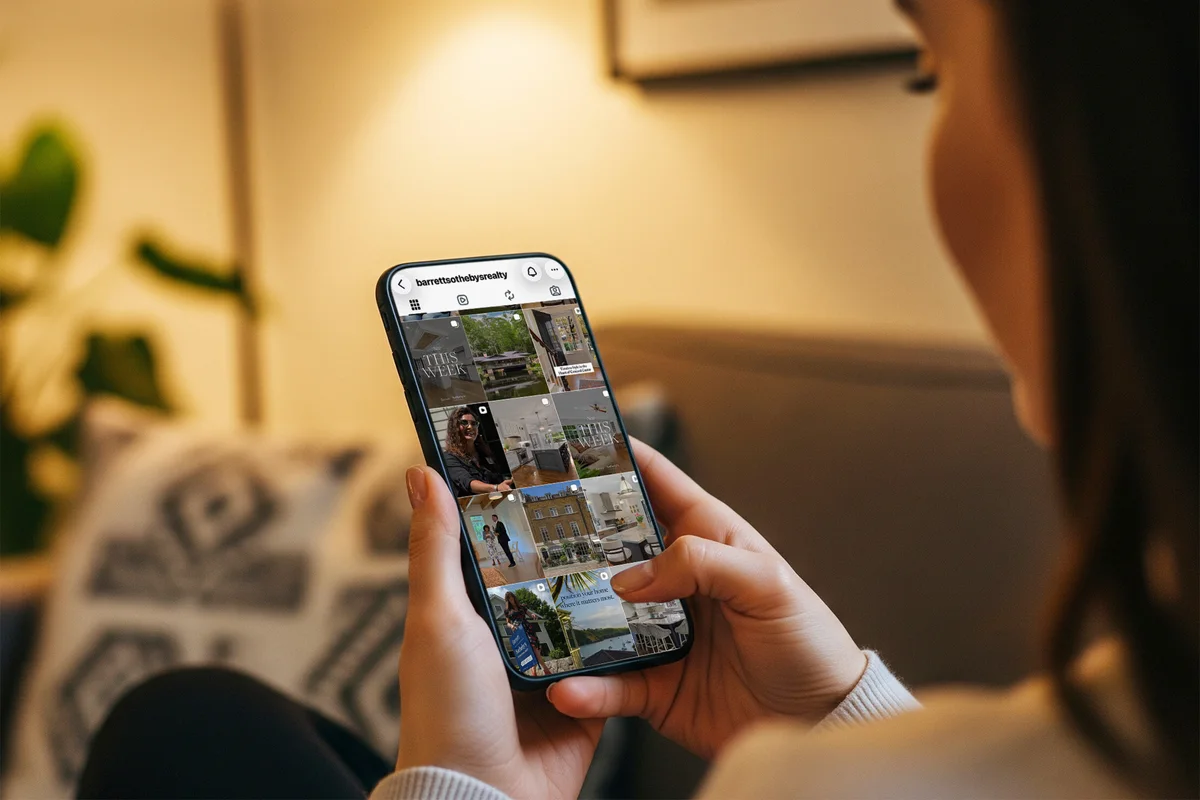 Scrolling the Barrett Sotheby's International Realty Instagram feed on a phone