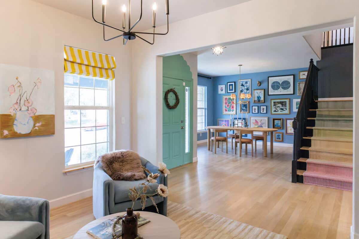 Open living and dining area with a gallery-wall staircase at 2664 E 137th Place, Thornton