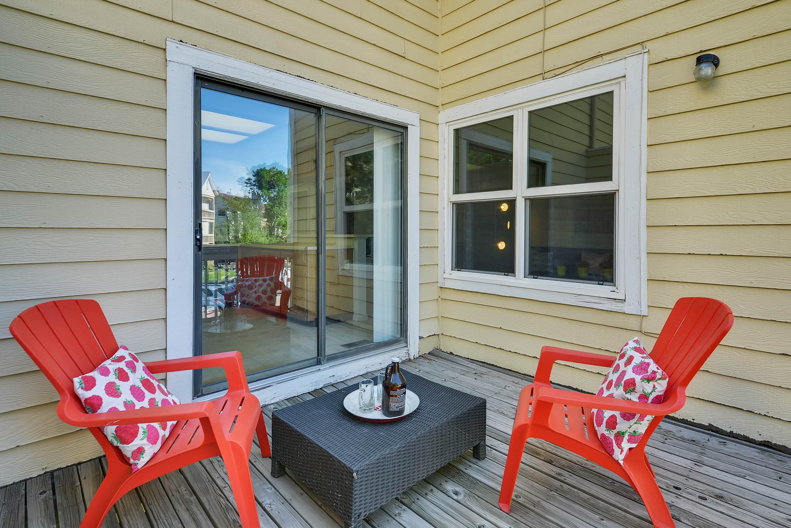 Cozy Aurora Patio with Red Chairs