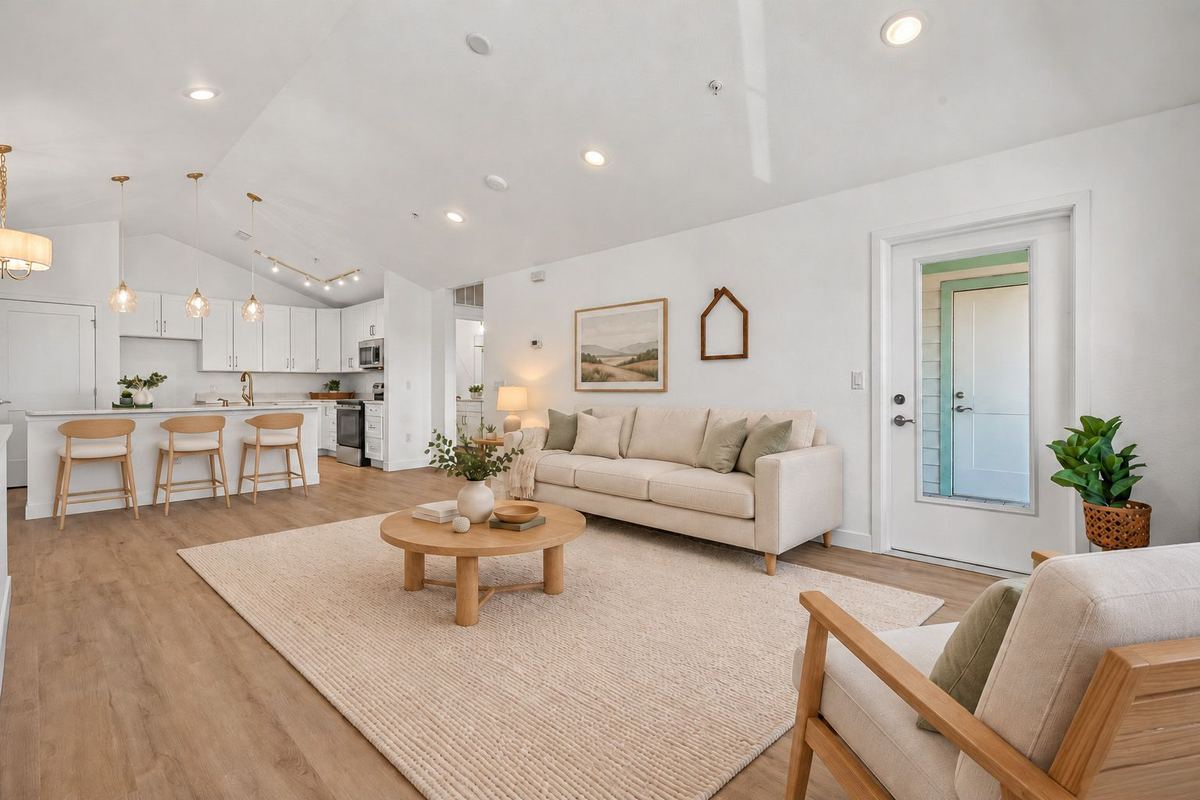 Vaulted living room and kitchen in a Flowergate plan at Hunters Chase