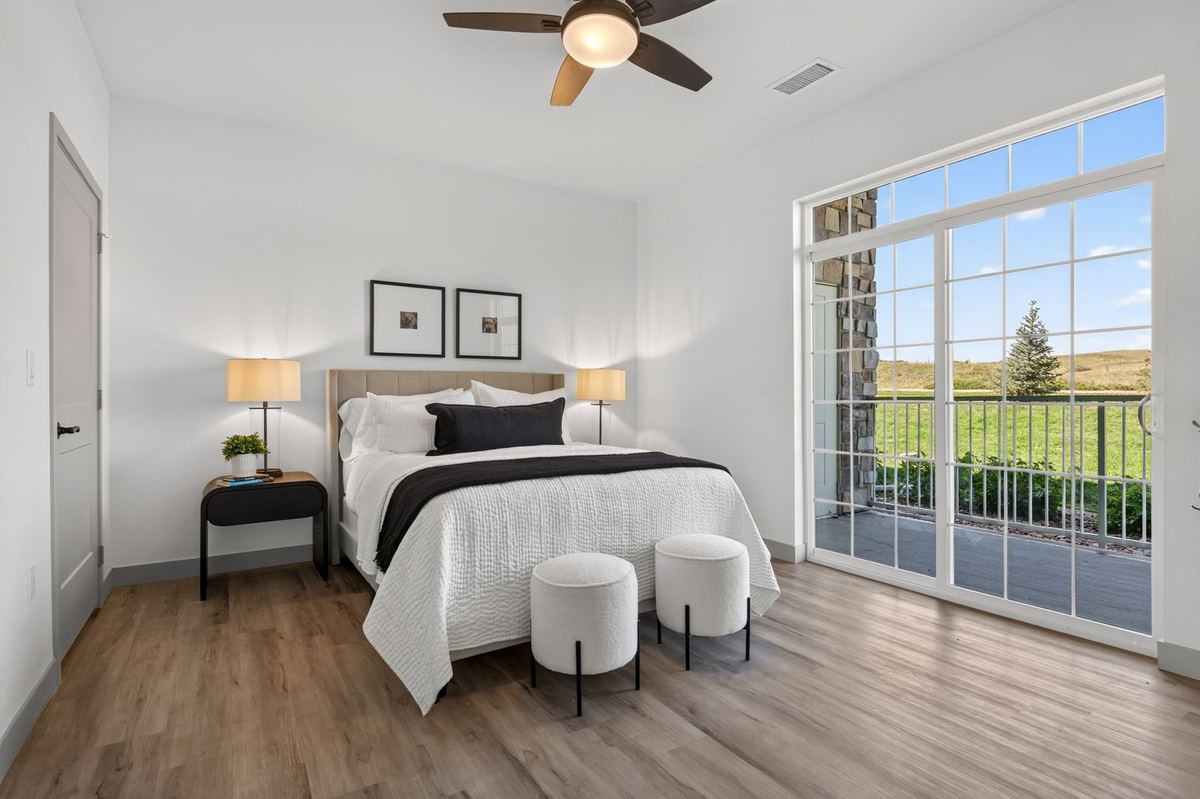 Primary bedroom with patio doors at Hunters Chase