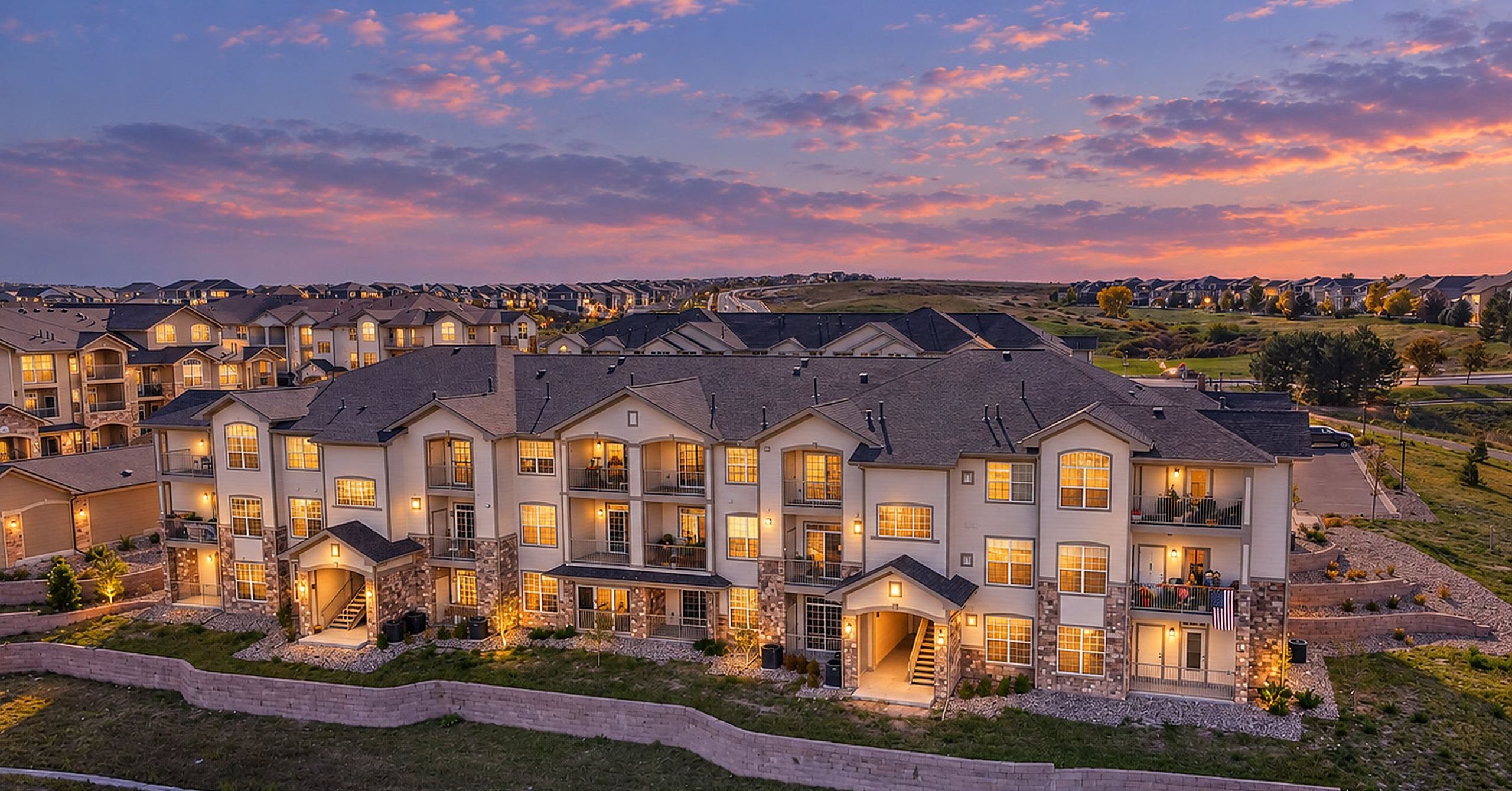Hunters Chase at Stroh Ranch condominiums at dusk in Parker, Colorado
