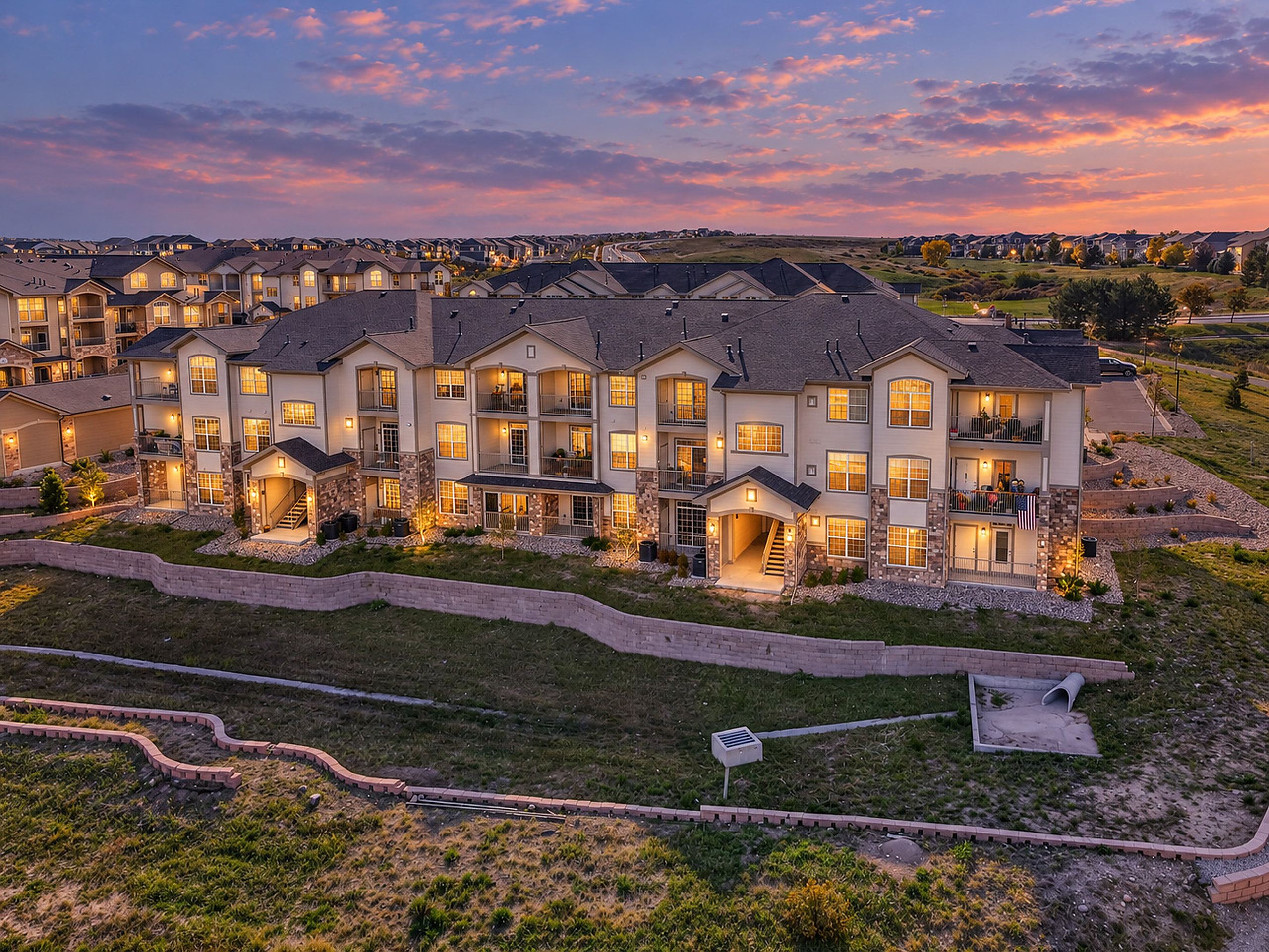 Hunters Chase at Stroh Ranch condominiums at dusk in Parker, Colorado