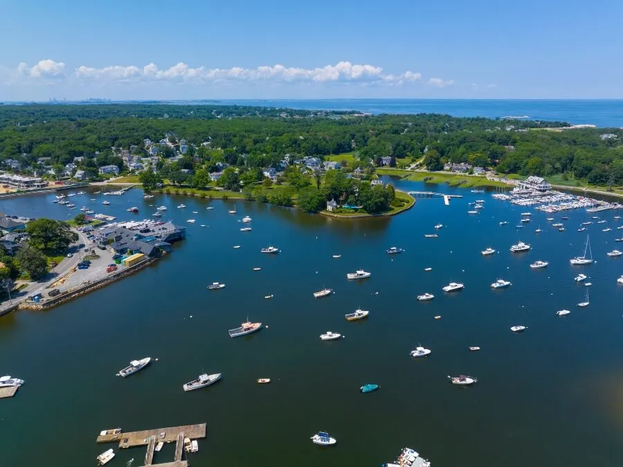 Cohasset Cove aerial view including fishing boat in the harbor in town of Cohasset, Massachusetts MA