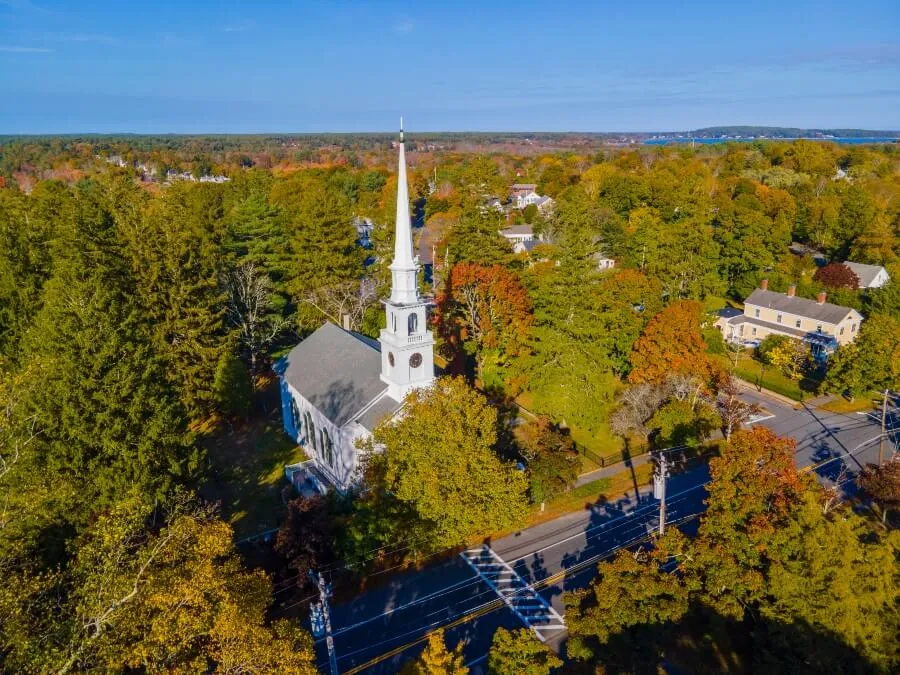 First Unitarian Church with fall foliage aerial view at 223 Main Street, in historic town center of Kingston, Massachusetts MA