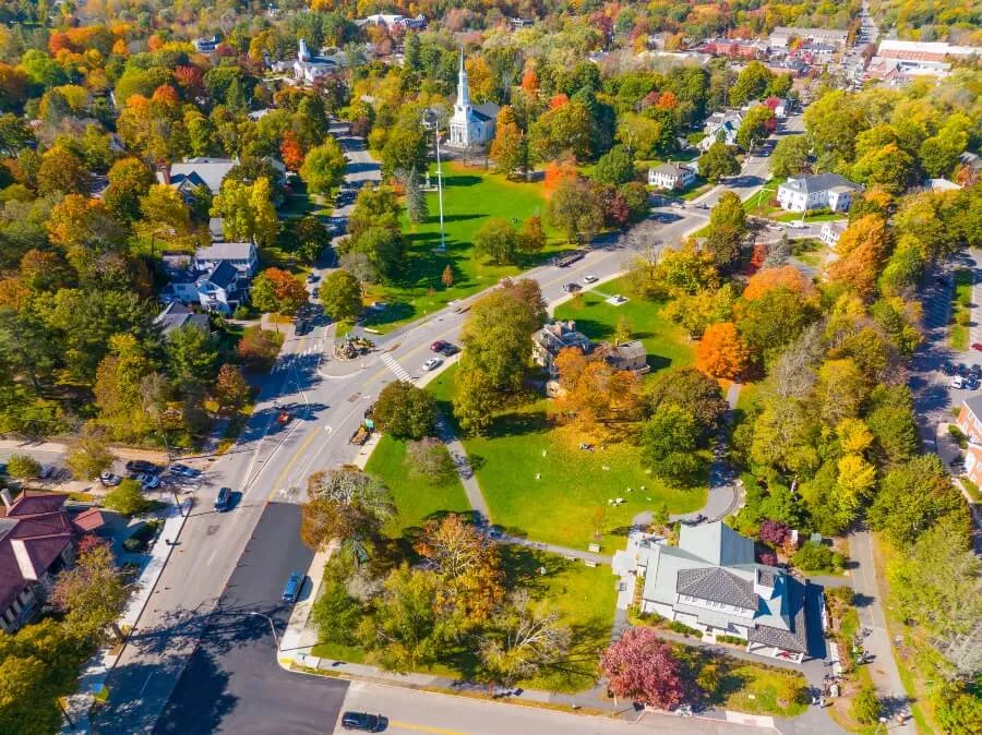 Lexington town center aerial view in fall including Visitor Center, Lexington Common and First Parish Church, town of Lexington, Massachusetts MA