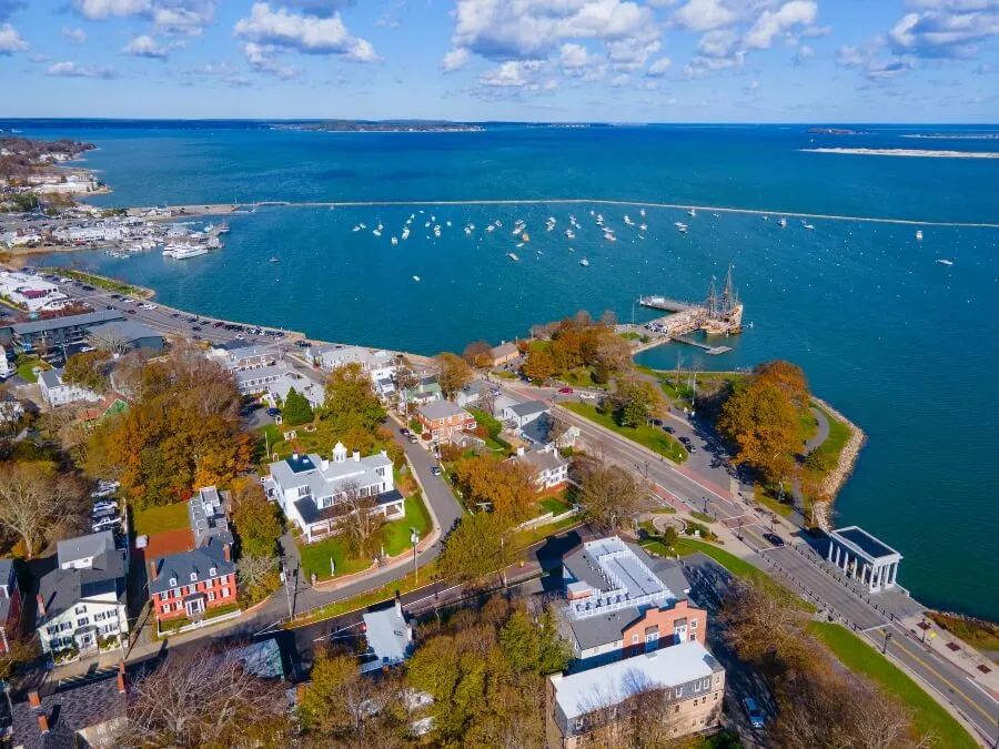 Plymouth Bay and Plymouth Village Historic District aerial view, including Antique ship Mayflower, in town center of Plymouth, Massachusetts MA, USA.  Licensed  Save to Library  Preview Crop  Find Similar   File #:  472702341 Plymouth Bay and Plymouth Village Historic District aerial view, including Antique ship Mayflower, in town center of Plymouth, Massachusetts MA