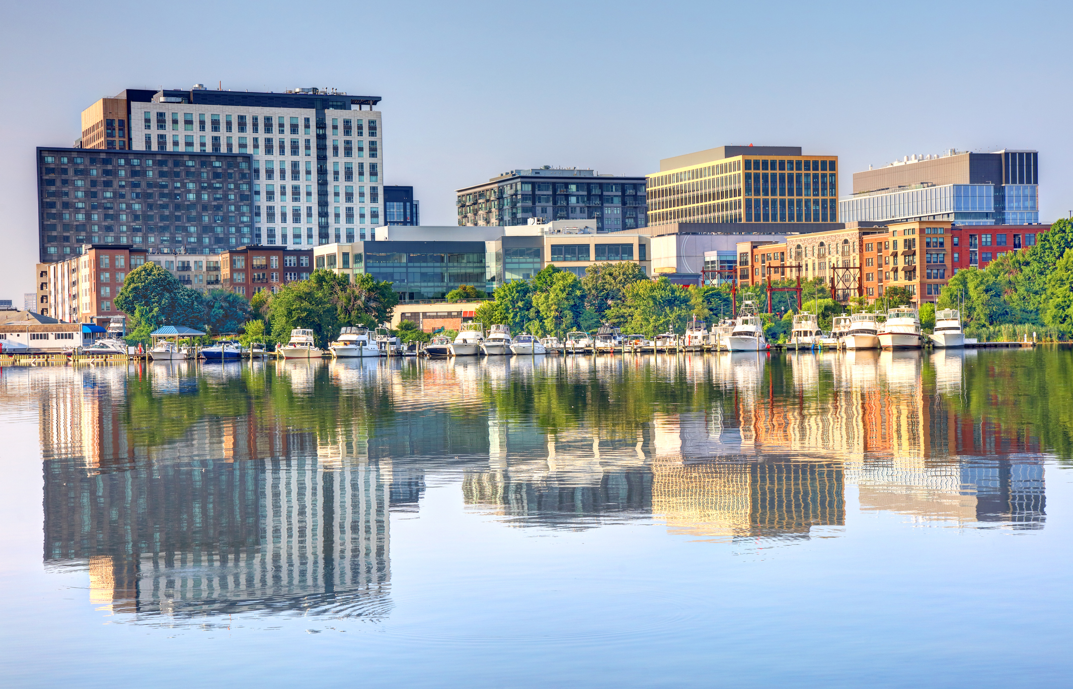 Somerville city center aerial view on Somerville Avenue with Boston skyline at the background in spring, city of Somerville, Massachusetts MA