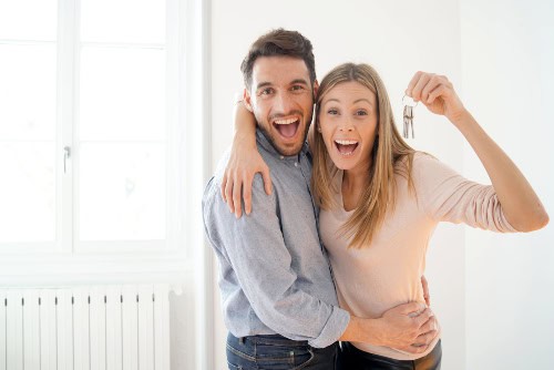 Happy Homebuyers with Keys to New Home